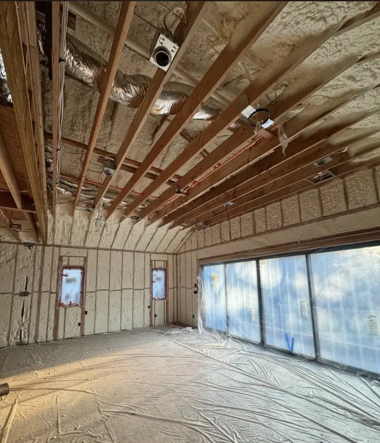 Interior walls and ceiling insulated with spray foam during new construction in Oakfield